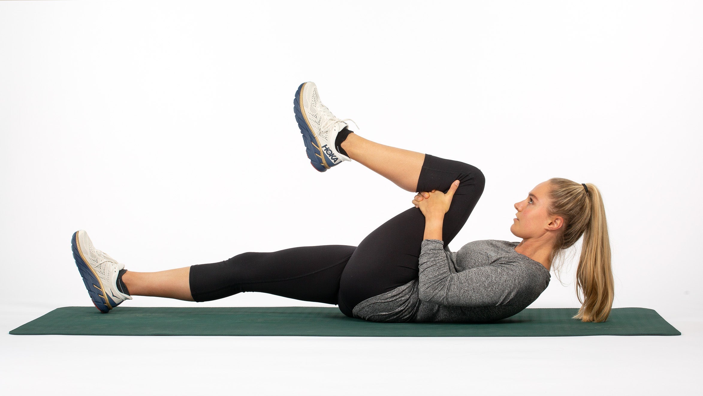 Woman runner demonstrating the best running stretches
