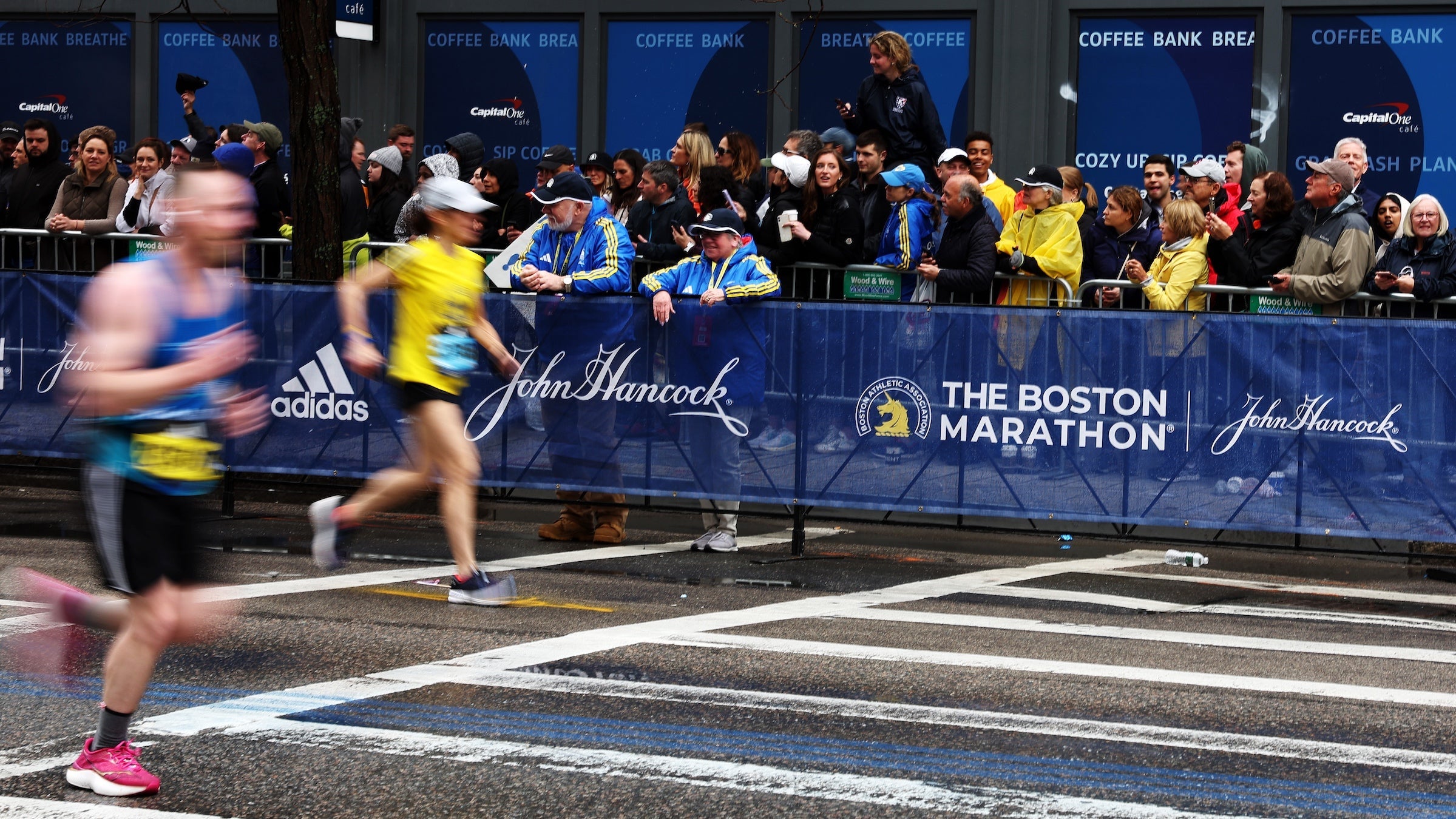 Two runners near the finish line of the Boston Marathon