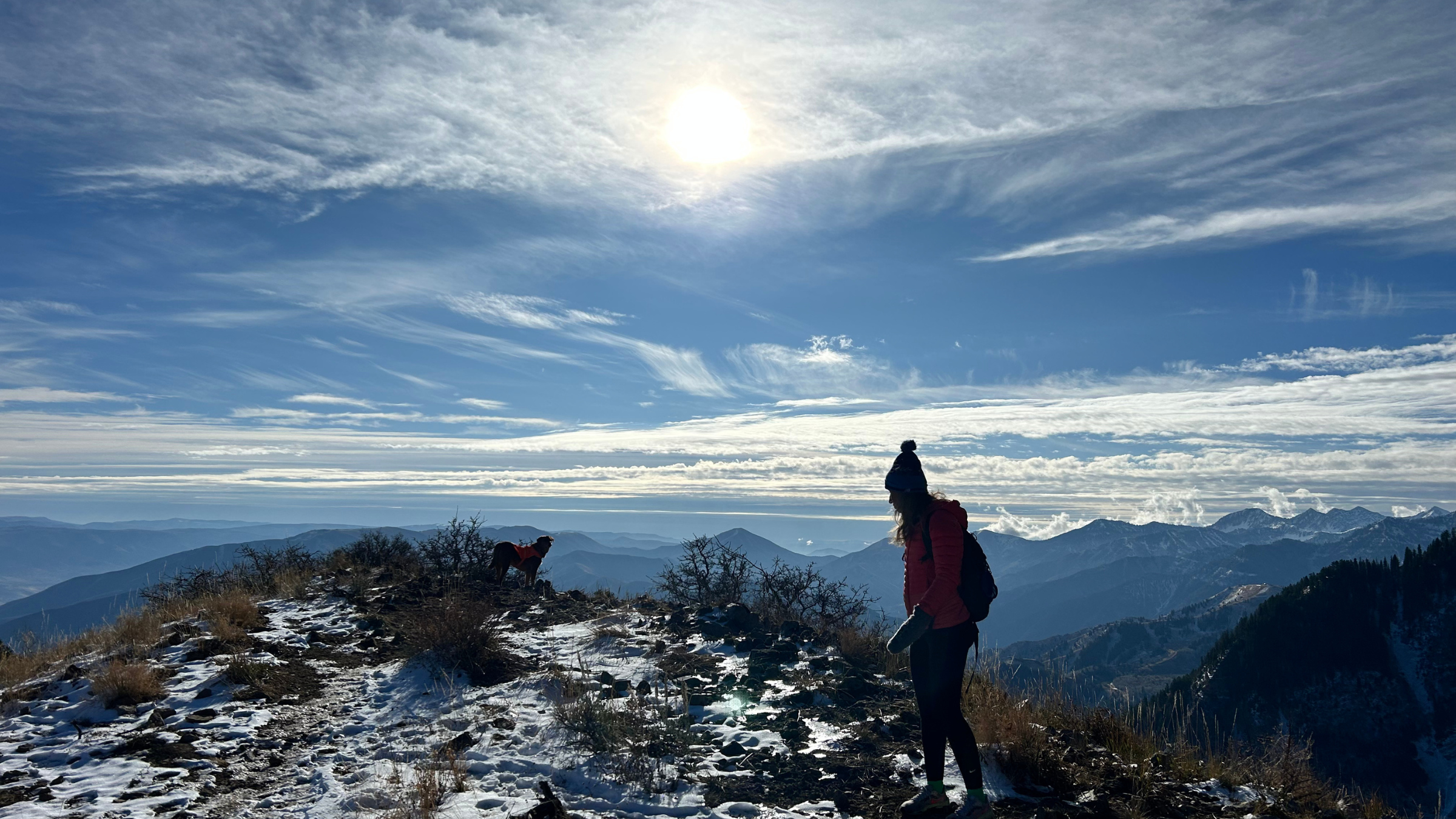 A woman on top of a mountain