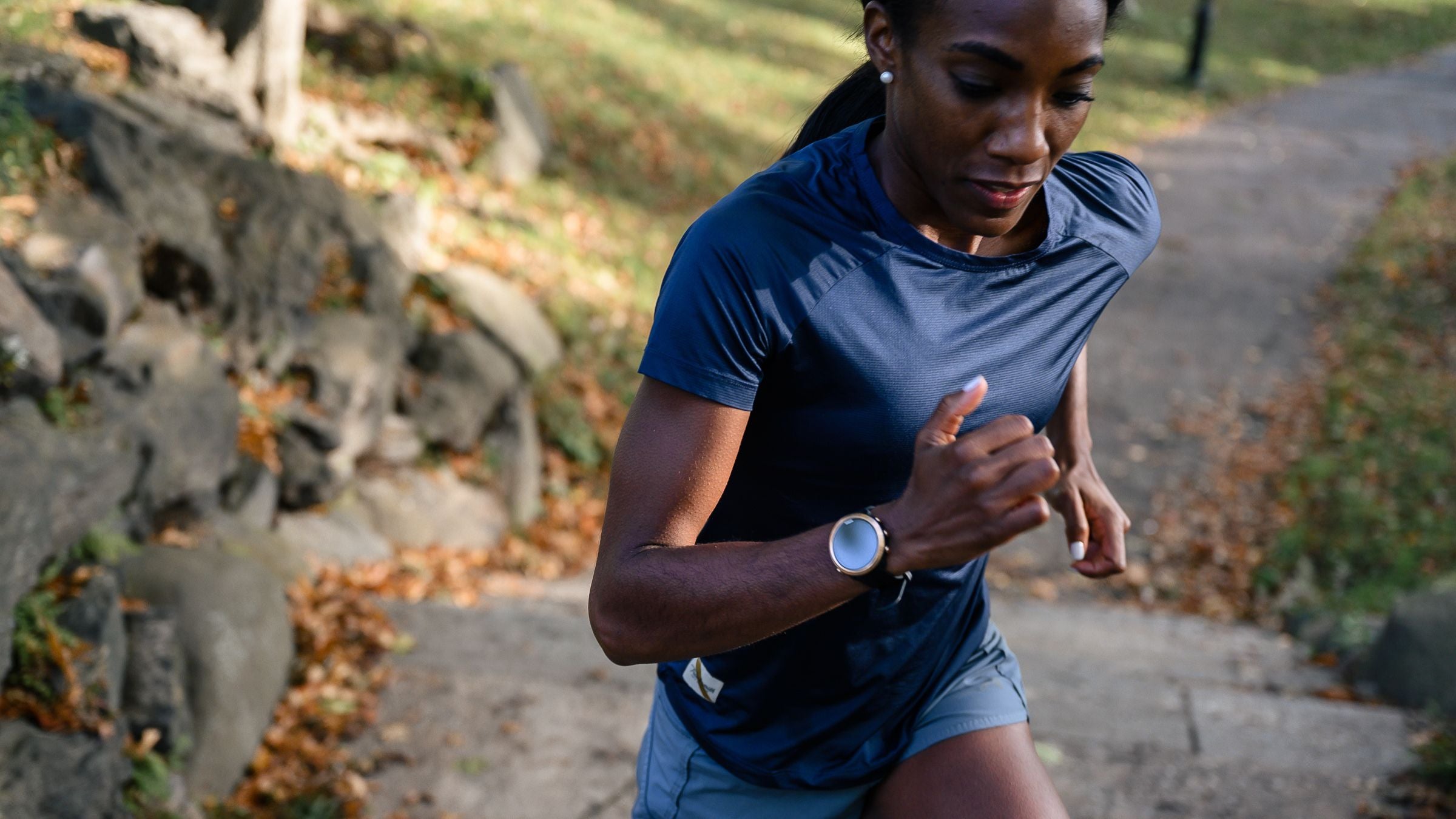a woman runs up city steps