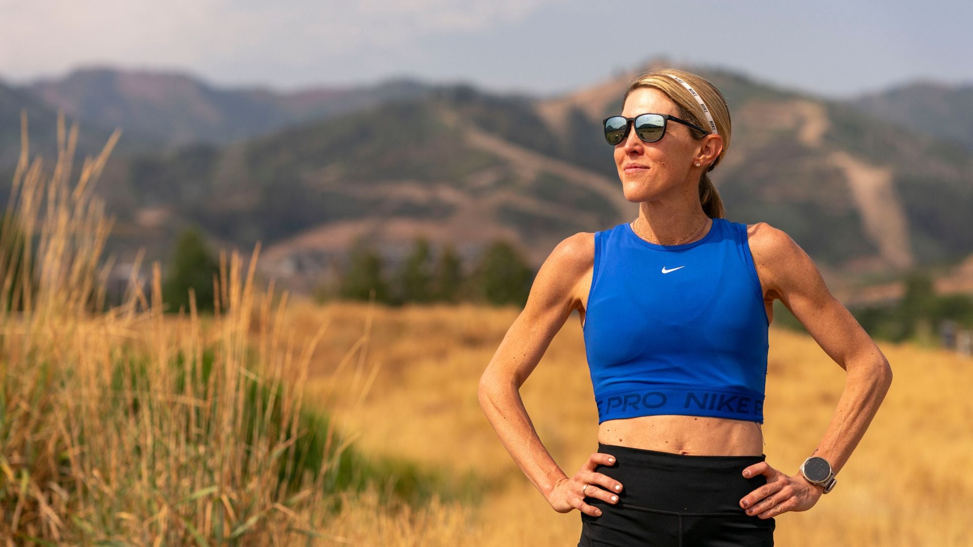 Keira D'Amato stands triumphantly in Park City Utah